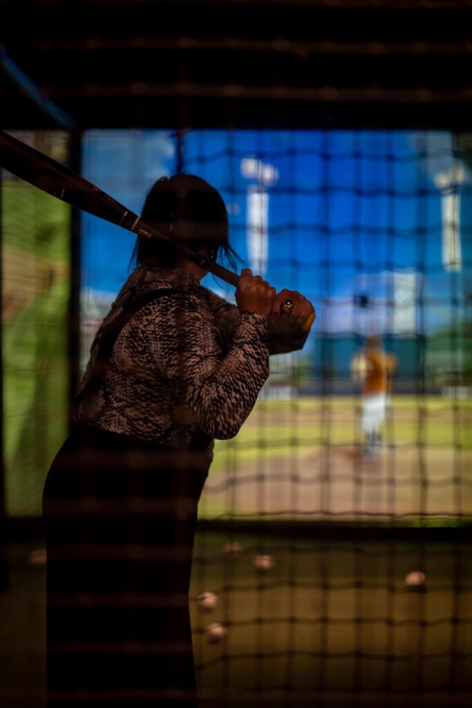 Indoor baseball batting experience and Dallas nightlife entertainment at Batbox sports venue