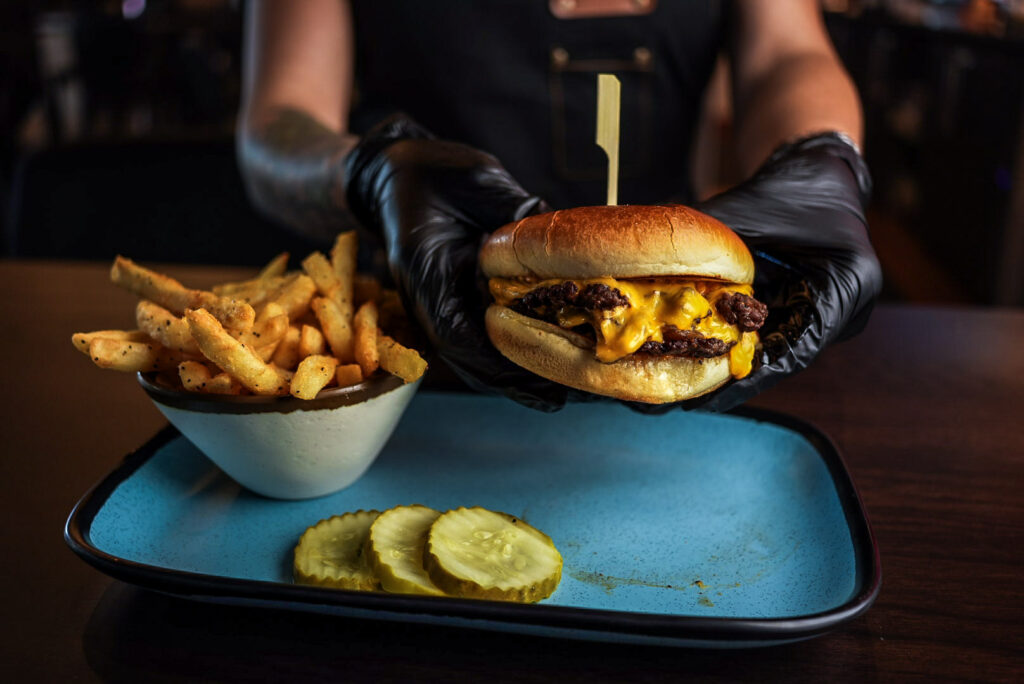 gourmet-burger-fries-menu-batbox.jpg Gourmet burger and fries from the food menu at Batbox Dallas sports entertainment venue