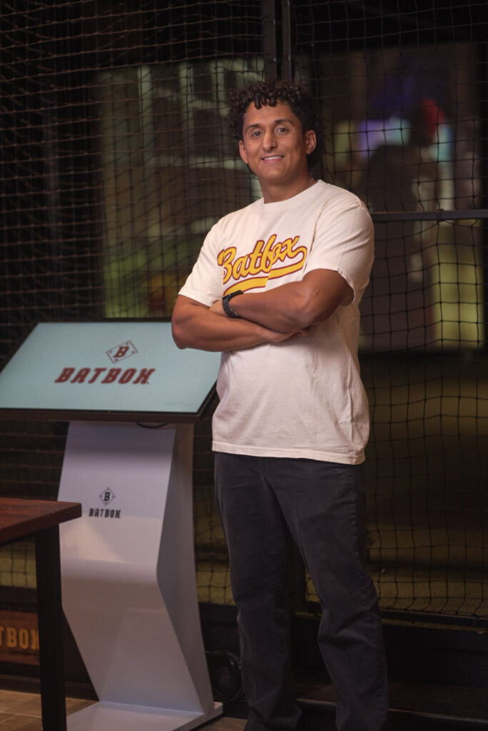 batbox-baseball-hitting-simulator.jpg Guest using a baseball hitting simulator at Batbox Dallas indoor sports entertainment venue